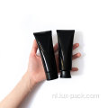 Zwarte plastic fles aangepaste lege roomlotionbuis